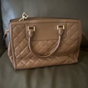 Michael Kors bubble bag in good condition. All zip was work.